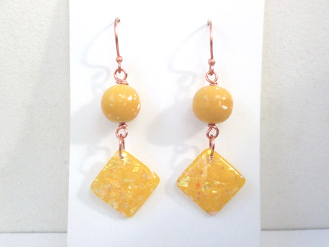 Bright bold boho funky earrings with sunny lemon yellow bead dangles and hand forged copper hook ear wires. Cosmic, abstract, geometric statement jewelry handmade for summer