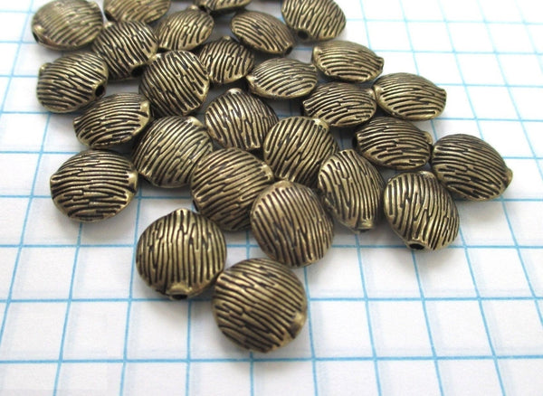 Brass beads - rustic textured antiqued, etched puffed coins 10mm